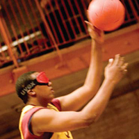 Chas, an 18-year-old student at TSBVI, says goalball is not as easy as it looks. Photo by Sarah Wilson.