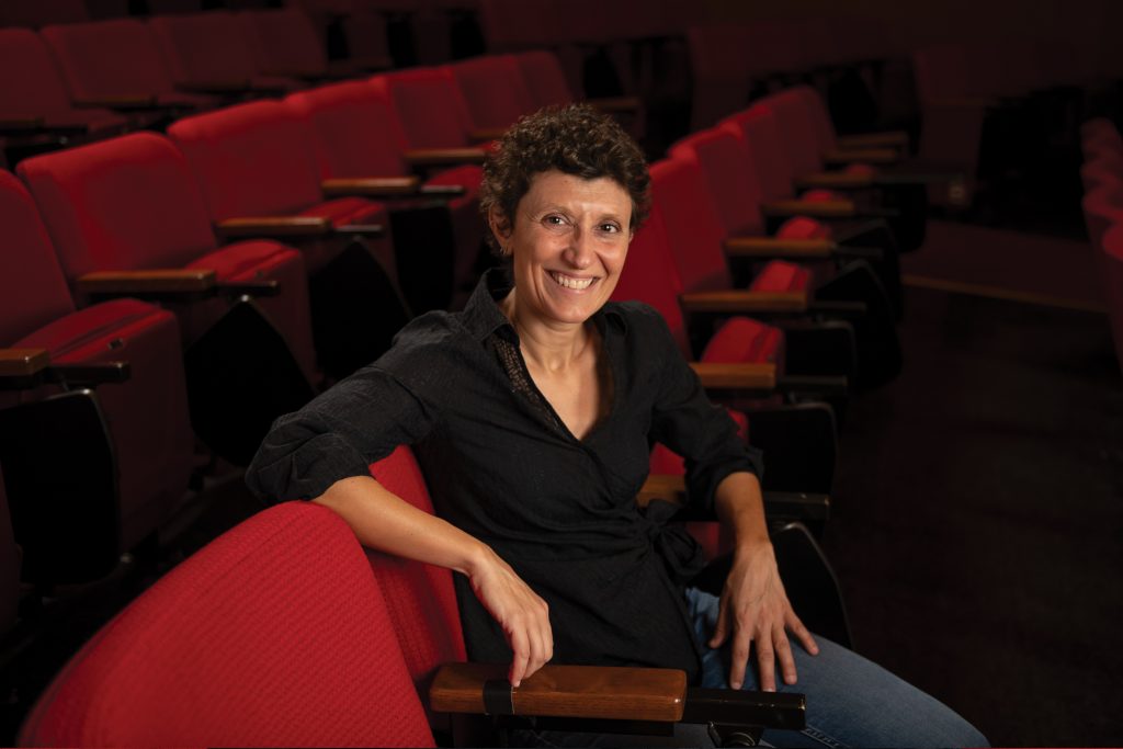 Photo of Paola Bonifazio in an empty movie theater.