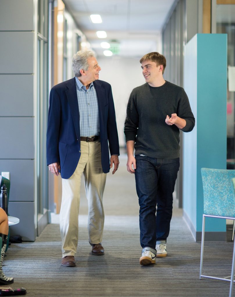 Michael Stoff and Plan II senior Thomas Boswell in the Plan II Honors Suite.