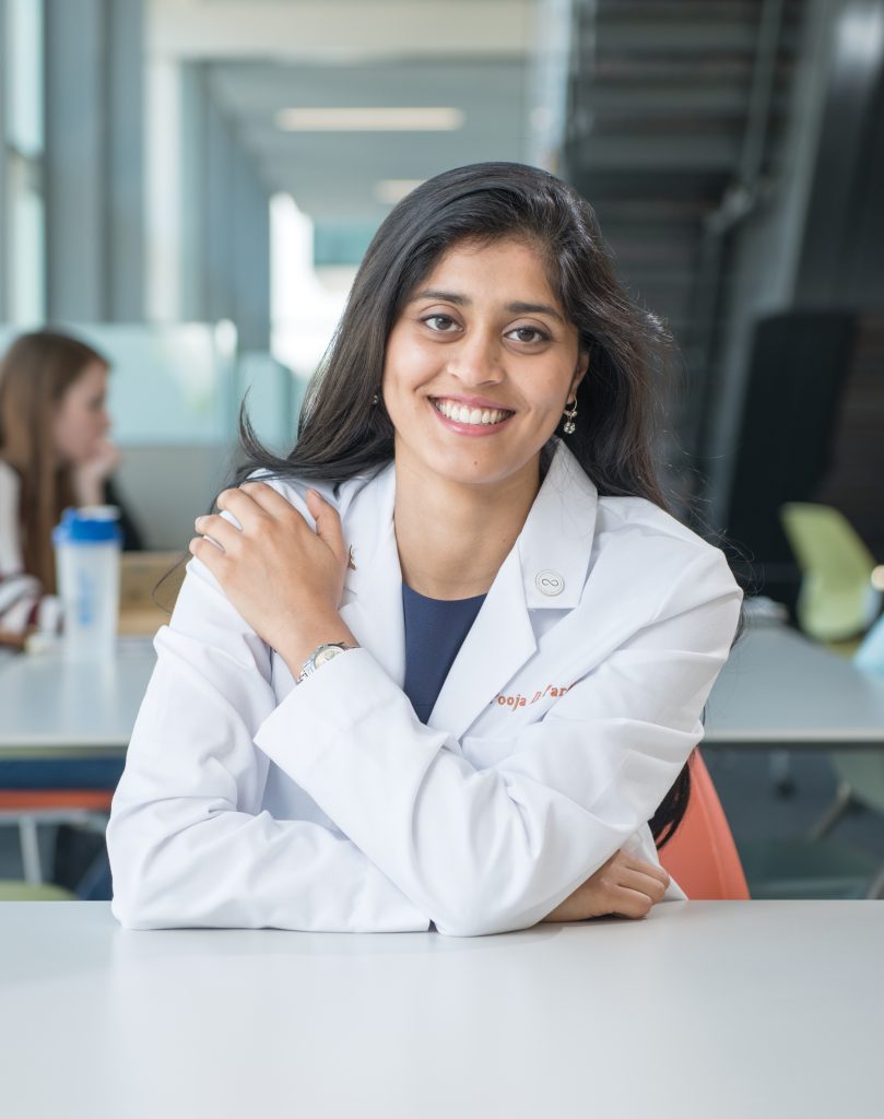 Psychology alumna Pooja Parikh in the Dell Medical School’s Health Learning Building.