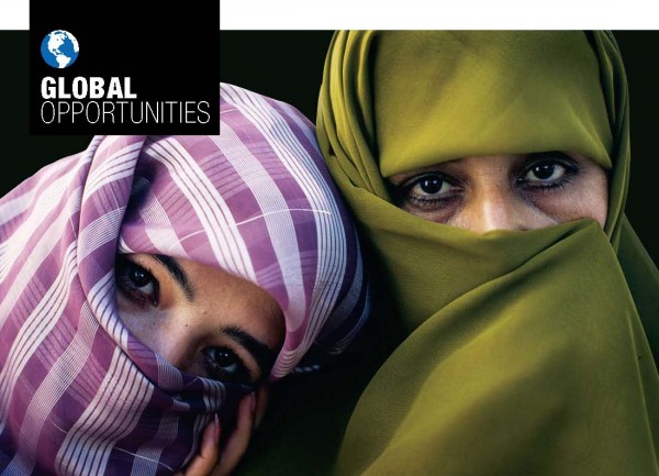 Close-up of two women wearing veils that cover their heads leaving only their eyes visible  