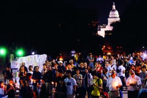group gathered at night outside of capital