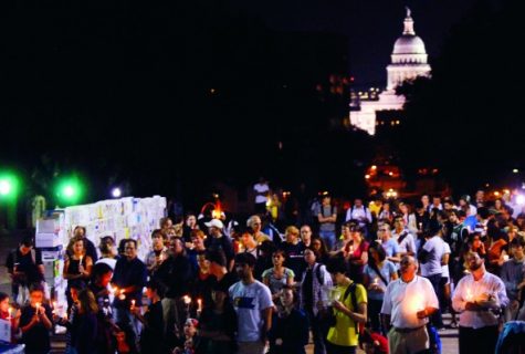 group gathered at night outside of capital
