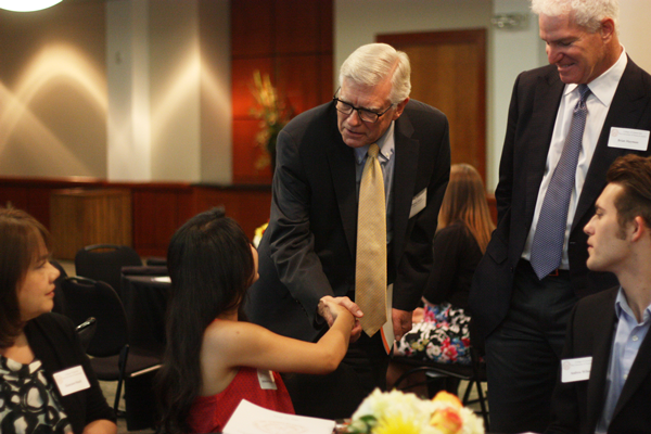 Dean Randy Diehl greets DDG Rebekah Rodriguez and her family at the luncheon Thursday.