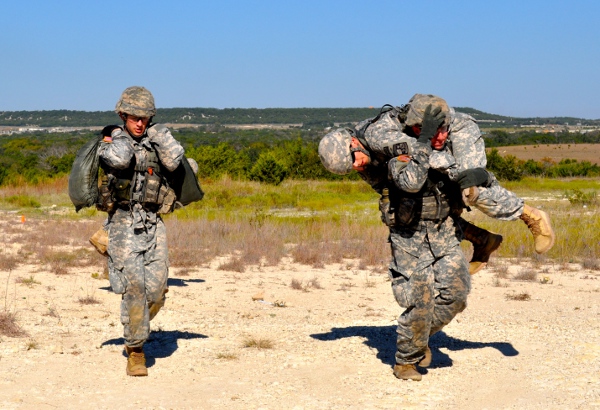 Cadets participate in a portion of the commander’s challenge, the 7-foot challenge, where teams had to climb a hill with no more than six boots on the ground at any time. Some teams elected to carry their teammates, others tried a “wheelbarrow” technique and one team simply removed their boots.