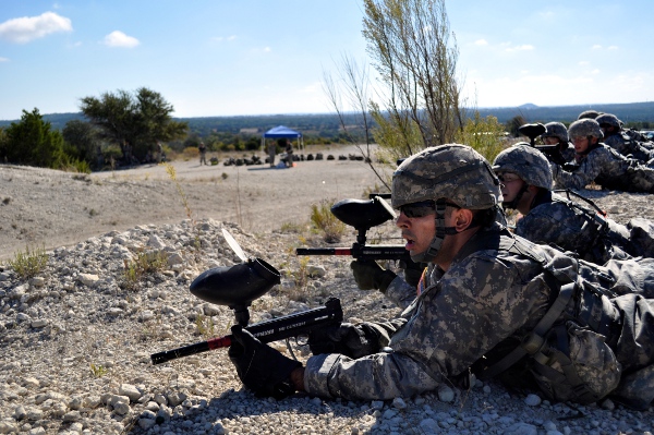 Cadet Nicholas Corti preparing to shoot silhouettes with a paintball gun.