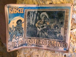 Old movie flyer for the Teatro Communale on display in make-shift community museum in Sicily