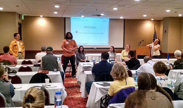 Garza speaking on a panel with other interns at the PNTS Workshop.