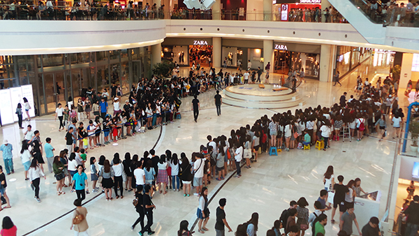 K-Pop fans gather an hour before an autograph event (fansign). Fans are a huge part of K-Pop and this sort of connection-building interaction is very important to its success, Lovelace says.
