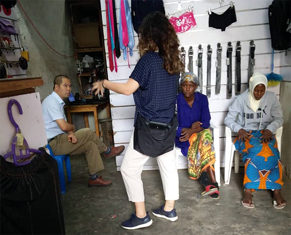 Devon Hsiao conducting interviews in a retail space in Kampala, Uganda. 