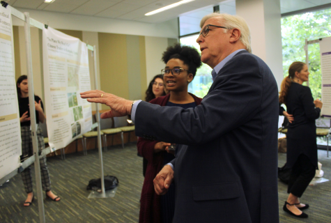 Dean Randy Diehl gestures at the poster of Tomaia Pamplin during the event.