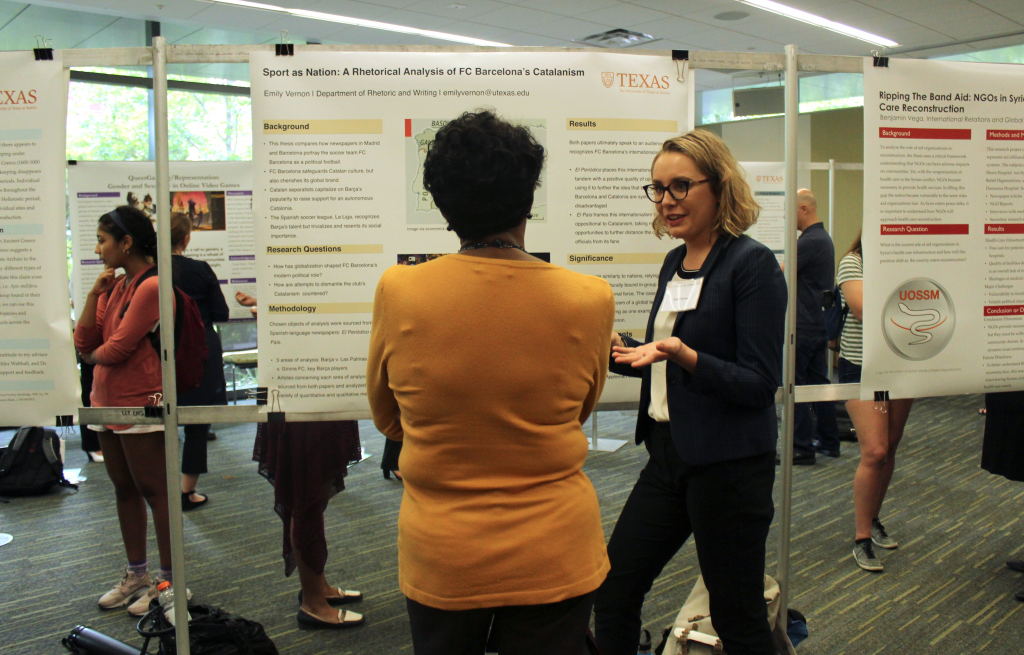 Emily Vernon discusses her research poster. 