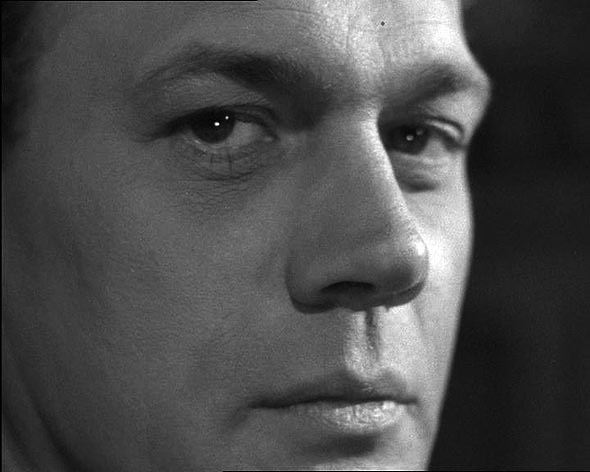 A close up black and white photo of Joseph Cotten.