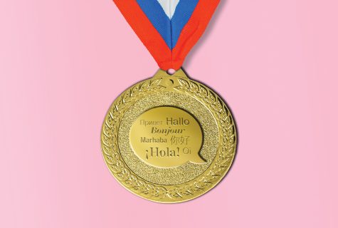 A gold medal with "hello" written in different languages.