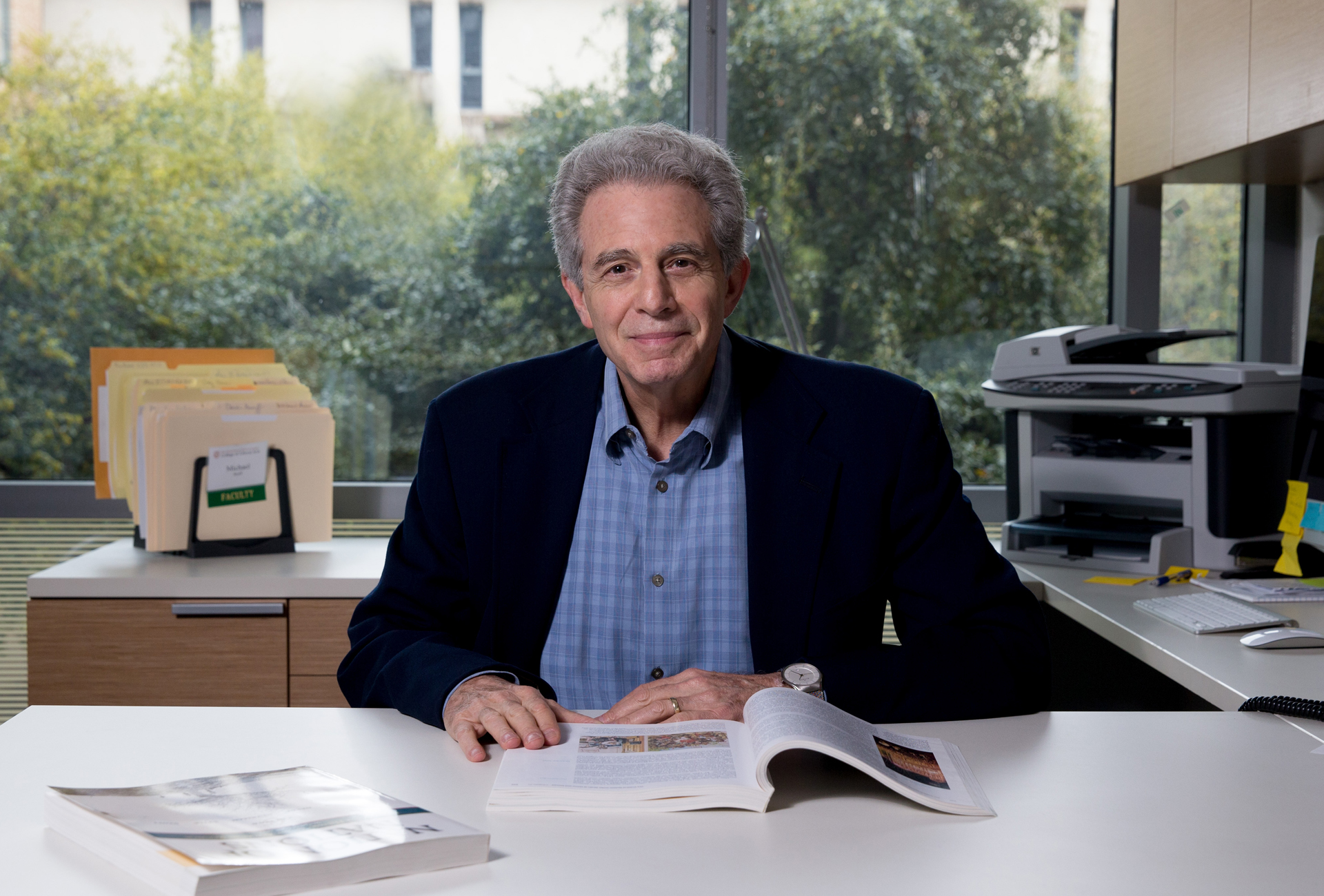 Portrait of Michael Stoff in his office located on the UT Austin campus.