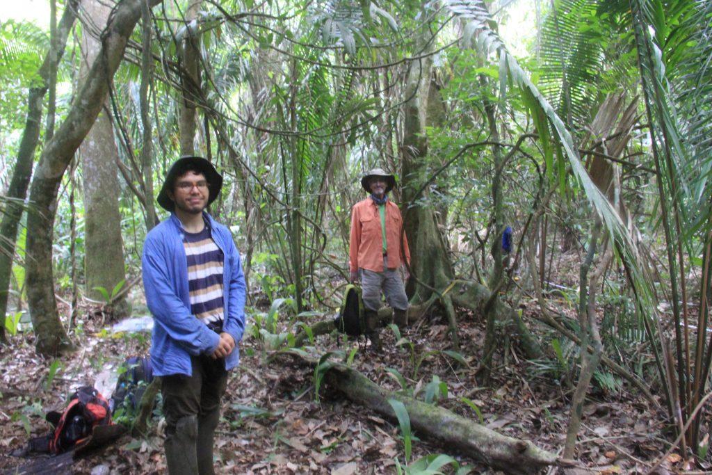 UT Austin researchers pose at research site in Belize.