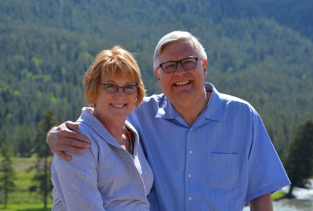 Mary and Randy Diehl with Yellowstone Park in background.