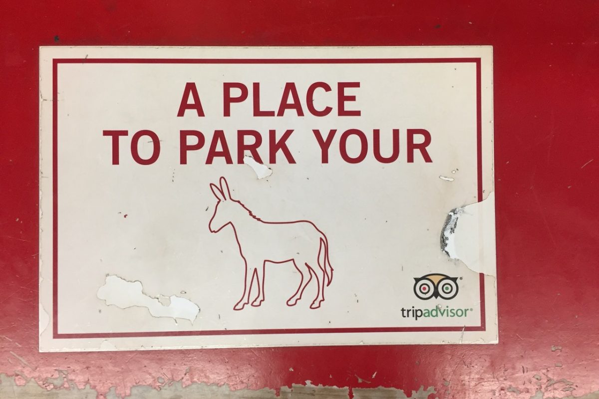 Red bench sign at carriage ride, 