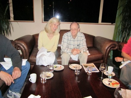 Annette Stanton and Jamie Pennebaker sitting on couch. 