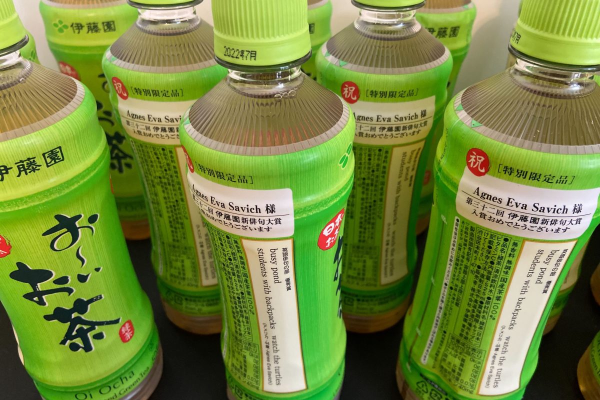 Bottles of green tea that include Agnes Savich's haiku printed on the label.