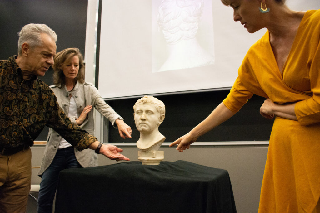 White marble Roman bust found at Austin Goodwill being assessed by University of Texas at Austin Liberal Arts professors Stephennie Mulder, Penelope Davies, Rabun Taylor, and John R. Clarke